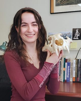 Chelsea Betts poses with an animal skull