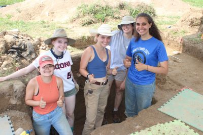 Field School students standing in a cellar at the Hollister Site