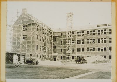 Beach Hall under construction, with scaffolding outside.