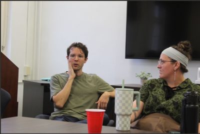 Close up of two grad students in discussion